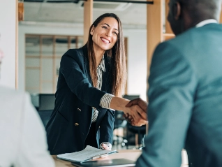 woman shakes hand of man