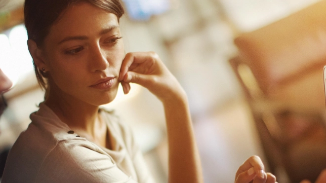 woman and man looking at laptop