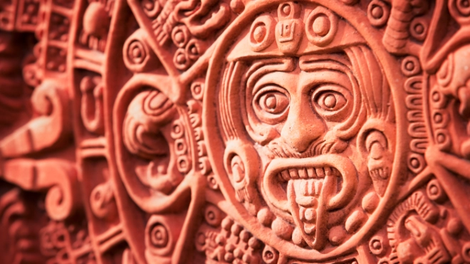Mexican face carving in a wall