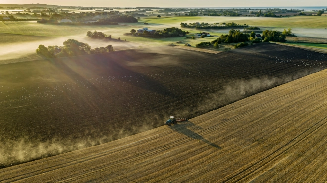 Tractor ploughing a rural field