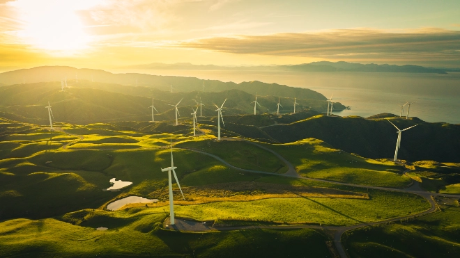 Collection of wind turbines on rolling hillside
