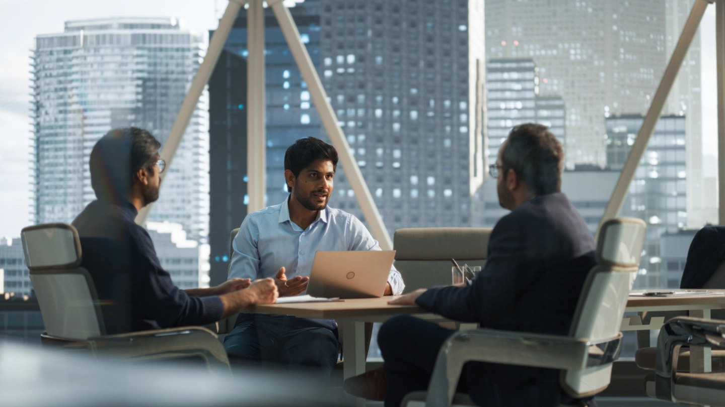 Three Young South Asian Colleagues Working in a Business image
